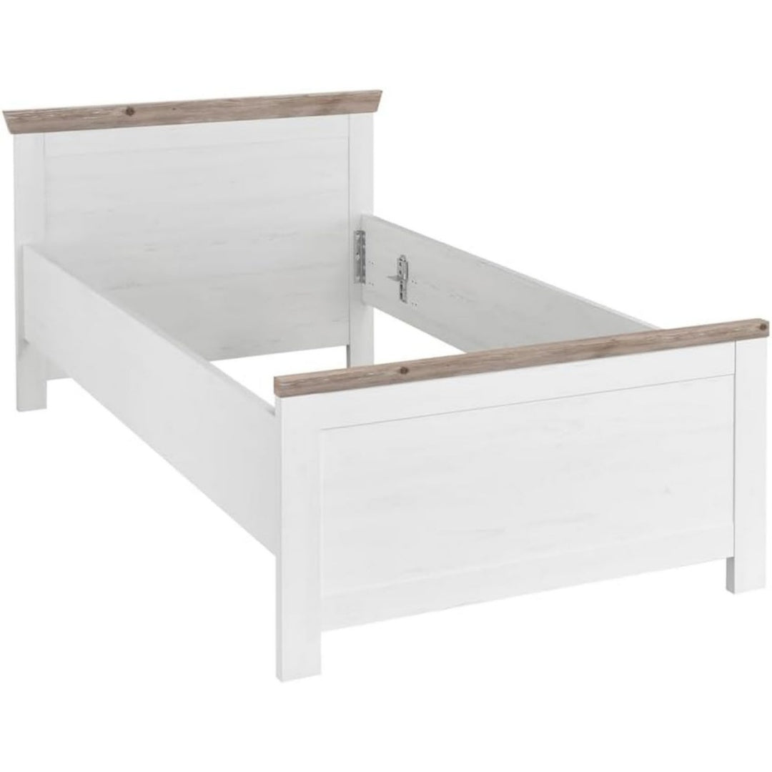 Das Bettgestell nimmt mit 115 x 86 x 208 cm Gestalt an